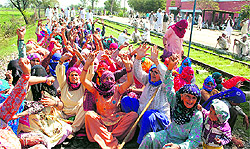 Protesters block a rail track in Haryana