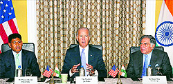 US Vice-President Joe Biden (C) speaks as former chairman of Tata group Ratan Tata (R) and Boeing India vice-president Pratysh Kumar look on during a meeting with business leaders in Mumbai on Wednesday