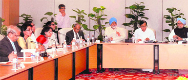 Prime Minister Manmohan Singh, Finance Minister P Chidambaram and Dy Chairman of Planning Commission, Montek Singh Ahluwalia during a meeting with business leaders in New Delhi on Monday.