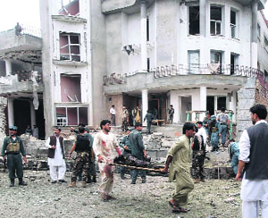 A body being carried away from the blast site in Jalalabad on Saturday.  