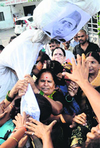 Protesting BJP workers carry an effigy of UP CM Akhilesh Yadav in Lucknow. 