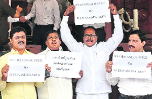 TDP MPs protest on Day 1 of the monsoon session in New Delhi on Monday.