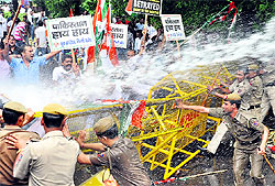Youth Congress activists brave water cannons during a protest near the Pakistani High Commission in New Delhi on Wednesday