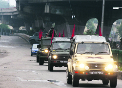 Army soldiers conduct a flag march during curfew in Jammu on Monday. Tribune photo: Anand Sharma
