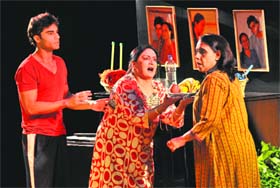 Artistes enact a scene from play "Jug Jug Jiyo" at the Tagore Theatre in Chandigarh on Saturday