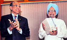 PM Manmohan Singh releases the fourth volume of book "RBI History - Looking Back and Looking Ahead" in New Delhi on Saturday. RBI Governor D Subbarao is also seen in the picture
