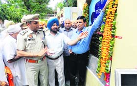 Prisoners’ welfare: ADGP Jail RP Meena (in a blue shirt) inaugurates the RO water system in Central Jail, Ludhiana