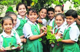 Children show their rakhis during the rakhi making competition at Green Land Senior Secondary Public School