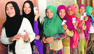 Women queue up to cast their votes during Ladakh Autonomous Hill Development Council elections in Kargil district of Jammu and Kashmir on Thursday. 
