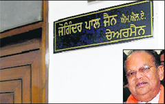 As per the nameplate, MLA Joginder Pal Jain (inset) continues to be chairman of Punjab State Warehousing Corporation.