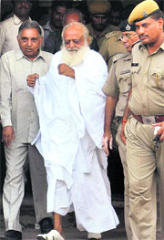 Asaram Bapu comes out of district sessions court in Jodhpur on Sunday. 