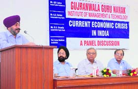 A participant speaks during a panel discussion on "Current Economic Crises" at the GGNIMT on Monday