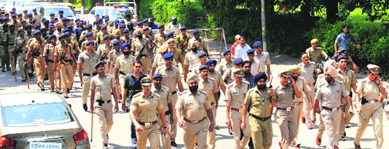 The Chandigarh Police takes out a flag march on the campus on Tuesday.