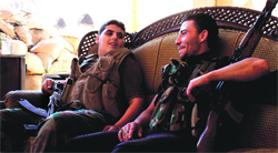 Free Syrian Army fighters rest on a sofa near the Grand Umayyad mosque in Aleppo on Tuesday.