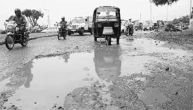 A damaged road in Industrial Area, Phase I, after it rained in Chandigarh on Friday.