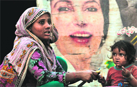 A homeless woman with her child in Lahore. About 22 per cent population lives in poverty.