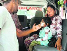 A child, injured in the communal clashes, is taken to a hospital in Muzaffarnagar. 