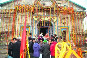ALL DECKED UP: Priests and devotees assemble for puja at Kedarnath Temple
