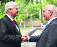 External Affairs Minister Salman Khurshid meets Sartar Aziz, Special Adviser to Pakistan PM Nawaz Sharif, on the sidelines of SCO Summit in Bishkek on Friday. 