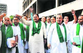 INLD legislators protest their suspension from the Haryana Assembly after they brought out CDs with alleged recording of Congress MLAs demanding money to arrange CLUs.