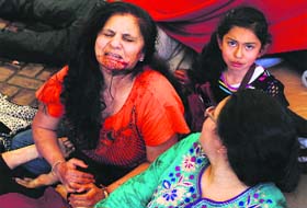 A wounded woman breaks down at the Westgate Shopping Centre in Nairobi