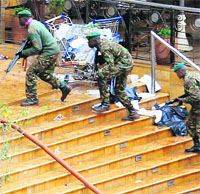 Kenyan soldiers take up position at the Westgate shopping mall in Nairobi on Tuesday. 