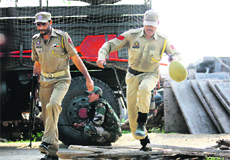 Policemen run for cover during a militant attack at an Army camp in Samba on Thursday. 