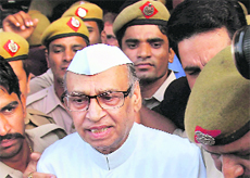 Police takes away Rasheed Masood after sentencing in New Delhi on Tuesday. 