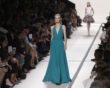 Models present creations by Lebanese designer Elie Saab from his Spring/Summer 2014 women's ready-to-wear collection during Paris Fashion Week.