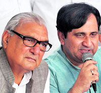 Congress general secretary Shakeel Ahmed with Haryana CM Bhupinder Hooda