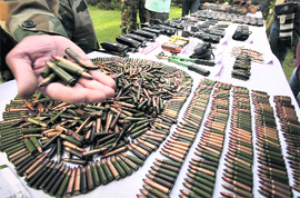 Arms and ammunition recovered from militants killed in a recent encounter in the Keran sector, on display at the Army headquarters in Srinagar on Monday. 