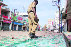 Shattered glass strewn across the street after anti-Telangana protests in Vijayanagaram on Monday.