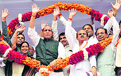 BJP chief Rajnath Singh with party leader Sushma Swaraj and others at a rally in Sonepat on Sunday