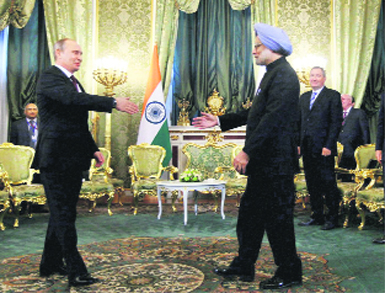 Prime Minister Manmohan Singh and Russian President Vladimir Putin greet each other in Moscow on Monday. 