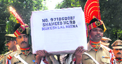 BSF men carry the coffin of their colleague in Jammu.