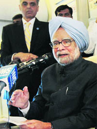 PM Manmohan Singh addresses a press conference on board his special flight on Thursday.