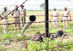 Security officials at the site where the three smugglers were shot dead near border at Mullankot in Amritsar.