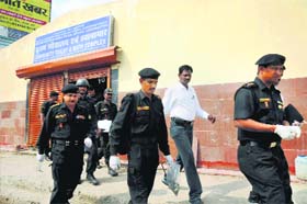 An NSG team after collecting samples from a toilet at Patna junction where a crude bomb exploded, on Monday