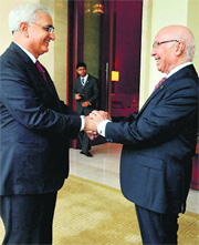 Foreign Minister Salman Khurshid with Pak PM Nawaz Sharif's adviser Sartaj Aziz in Gurgaon on Monday.