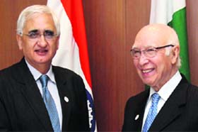 Foreign Minister Salman Khurshid with Sartaj Aziz, Pakistan PM Nawaz Sharif's adviser, in Gurgaon on Tuesday