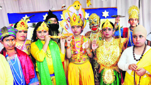 Students in colourful attire during an exhibition at AKSIPS in Sector 41, Chandigarh, on Saturday.