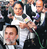 A Goa police team at Tehelka office in New Delhi on Saturday. PTI (Tejpal inset)