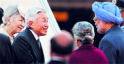 Prime Minister Manmohan Singh and wife Gursharan Kaur greet Japanese Emperor Akihito and Empress Michiko on their arrival in New Delhi on Saturday