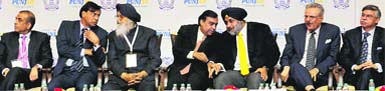 From left: Sunil Bharti Mittal, chairman of Bharti Enterprises, LN Mittal, chairman of Arcelor Mittal, Punjab CM Parkash Singh Badal, RIL chairman Mukesh Ambani, Deputy CM Sukhbir Singh Badal, YC Deveshwar, chairman ITC Ltd, and Sunil Munjal, JMD of Hero MotoCorp, at the Mohali summit. Tribune Photo: Manoj Mahajan