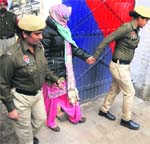 An accused in the case in police custody. Tribune photo