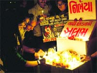People light candles in memory of December 16 gang-rape victim in Ahmedabad