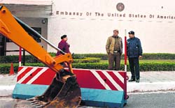A bulldozer removes a barricade in front of the US Embassy in New Delhi on Tuesday. AFP