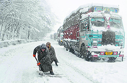 Trucks stranded on the national highway near Qazigund. The highway was closed for vehicular traffic for the second consecutive day on Monday due to snowfall.