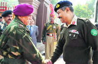 Pakistan DGMO Maj General Aamer Riaz (R) with his Indian counterpart Lt General Vinod Bhatia at Attari on Tuesday.  PTI 