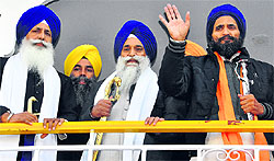 Sikh activist Gurbakash Singh Khalsa with Akal Takht Jathedar Gurbachan Singh (C) and Kesgarh Sahib Jathedar Mal Singh (L) at Gurdwara Amb Sahib in Mohali on Wednesday